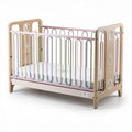 Wooden toddler bed with colorful safety bars and adjustable mattress height 70 x 50 x 80cm